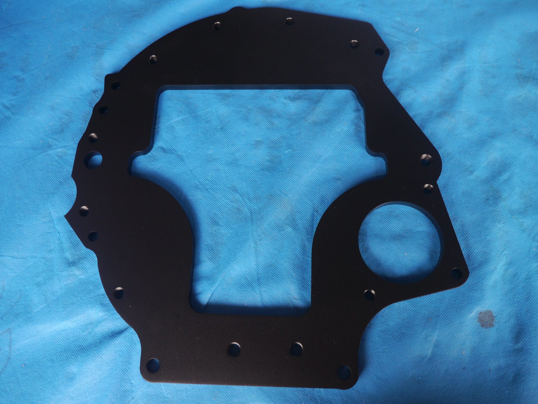 Black anodized CNC aluminum plate with machined holes